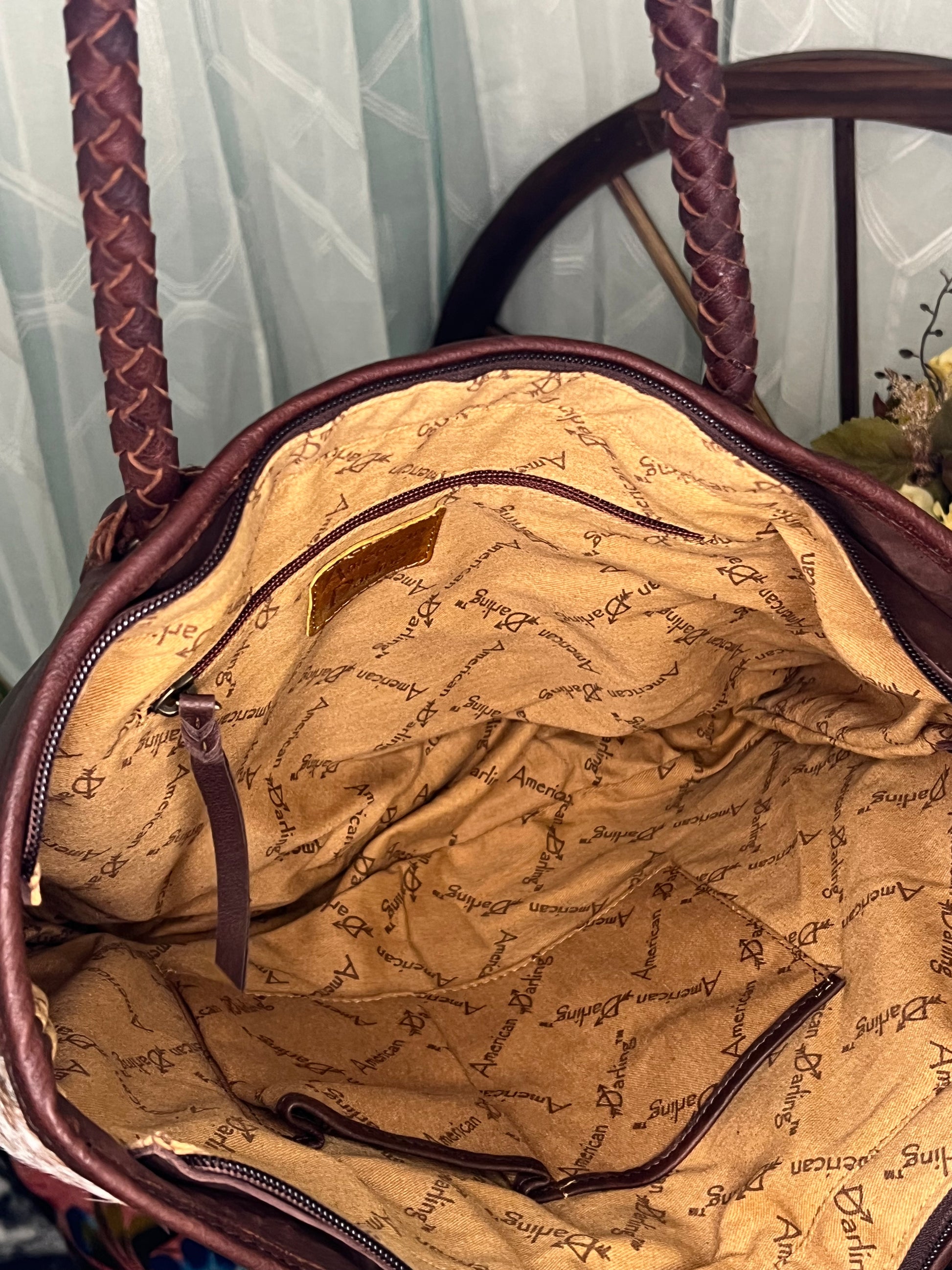 Round Rock Tote – full-grain leather tote with hair-on cowhide, leather fringe, and turquoise stone accent – luxury western-style statement bag.