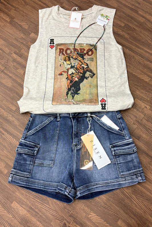 The Lula Sleeveless Top in oatmeal features a relaxed fit with a bold vintage rodeo playing card graphic on the front. Sleeveless and breathable, it’s styled for casual western flair and pairs effortlessly with denim.