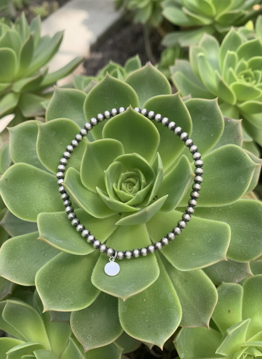 Perla Sterling Stretch Bracelet made with 3mm polished sterling pearls on a stretch band