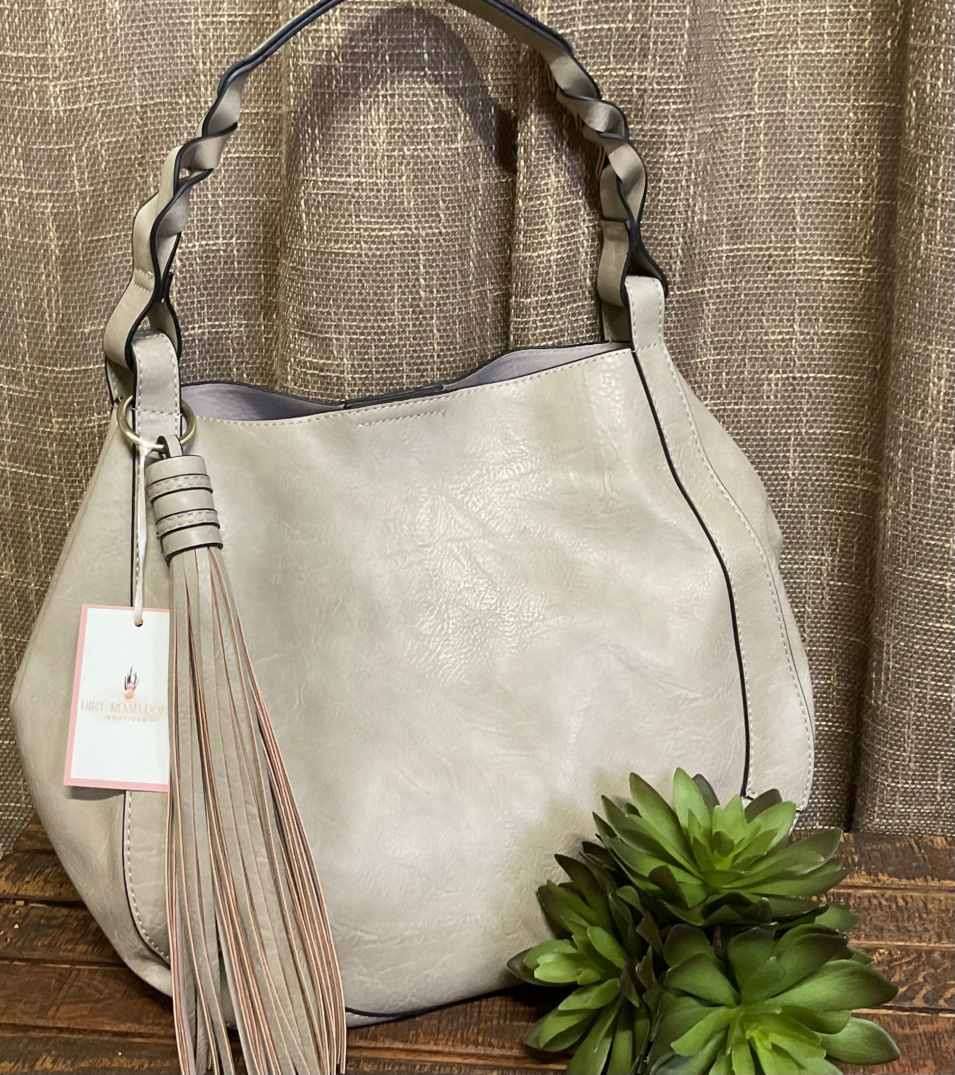 Ellie Hobo Bag in supple vegan leather with large tassel, braided handle, and removable inner crossbody bag – versatile, stylish two-in-one handbag.