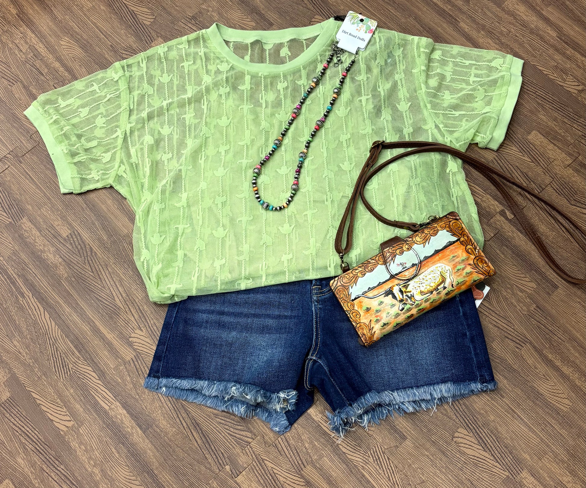 Sweetwater Lace Top with western lace pattern of boots, hats, and saddles – short sleeve round neck blouse with matching cami, relaxed fit.  Shown in lime green