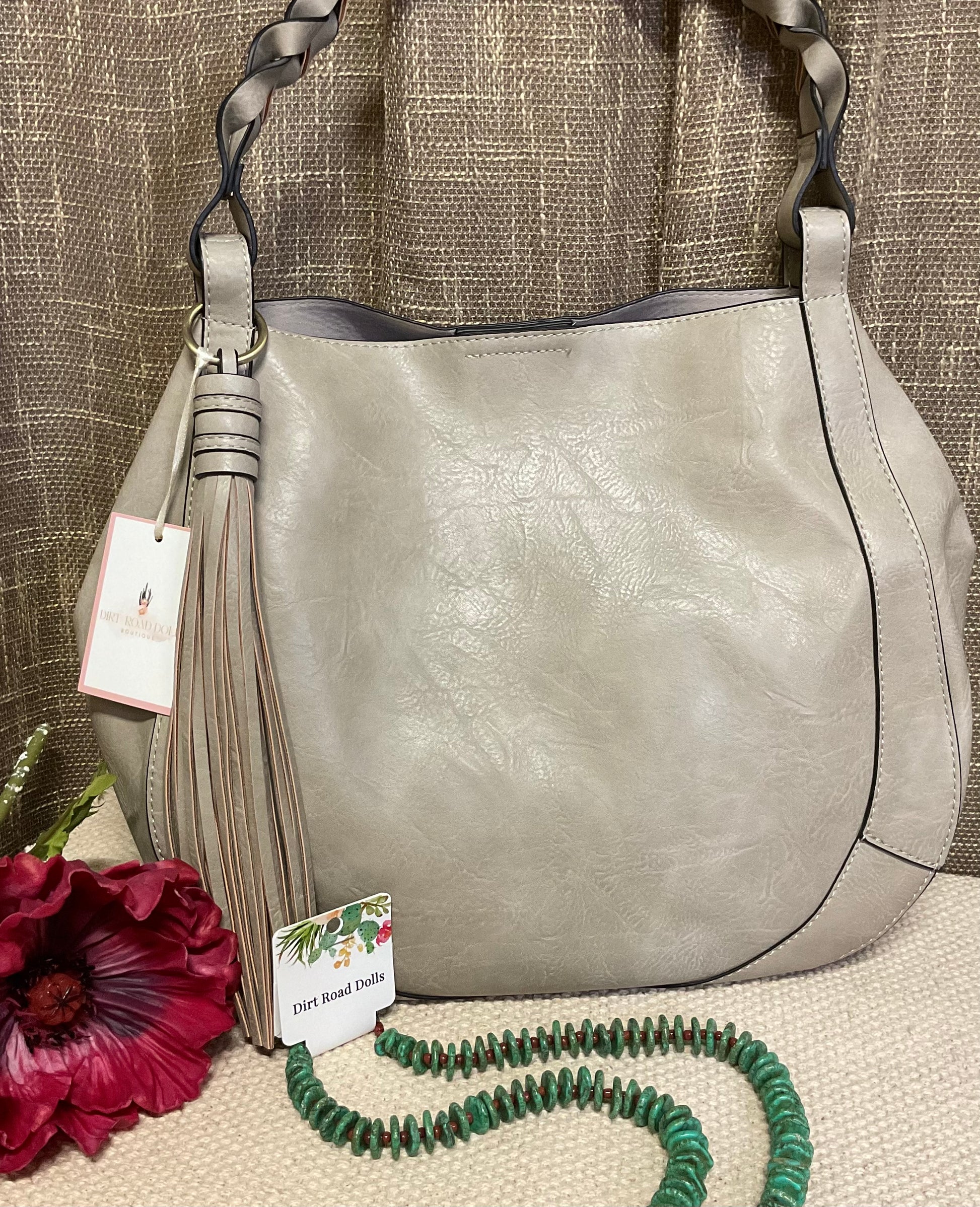 Ellie Hobo Bag in supple vegan leather with large tassel, braided handle, and removable inner crossbody bag – versatile, stylish two-in-one handbag.