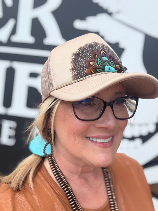 vintage-inspired trucker caps, each featuring feathered designs with a retro western vibe