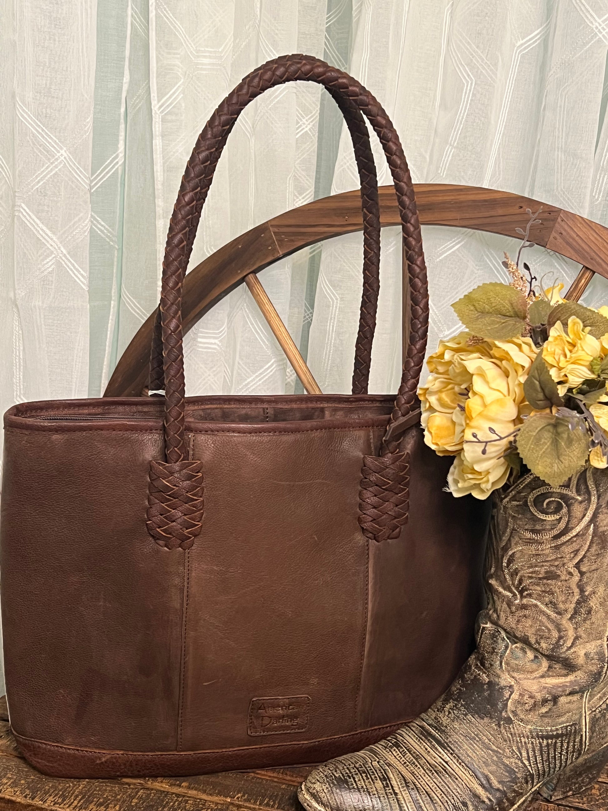 Round Rock Tote – full-grain leather tote with hair-on cowhide, leather fringe, and turquoise stone accent – luxury western-style statement bag.