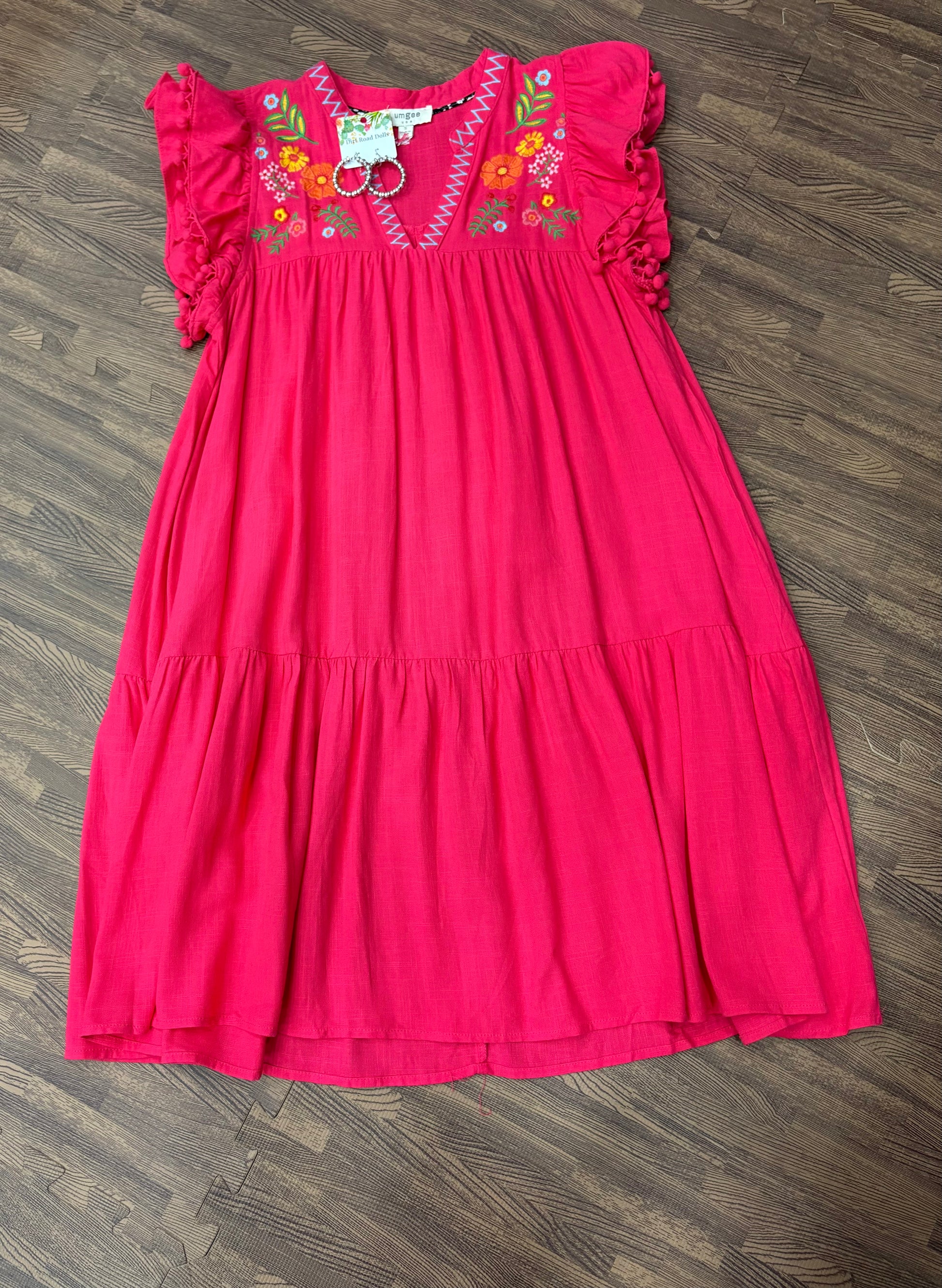 Rivka Embroidered Linen A-Line Dress with split neckline, ruffle sleeves, detailed embroidery, and pom-pom trim in lightweight linen-rayon blend.