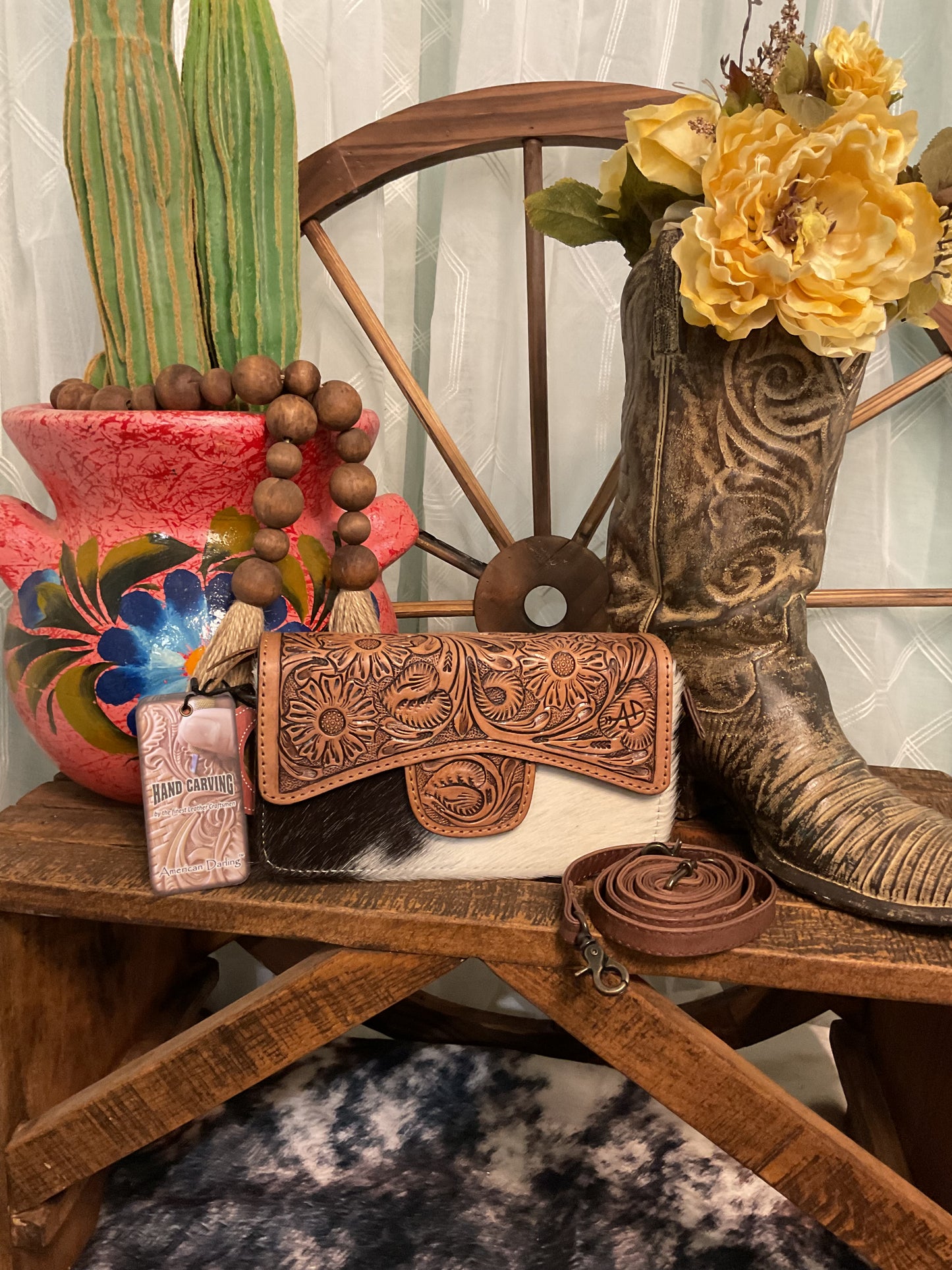 Uvalde Bag by American Darling – tooled leather and genuine hair-on cowhide bag with zippered and fold-over snap closure, detachable crossbody strap, versatile clutch or crossbody style.