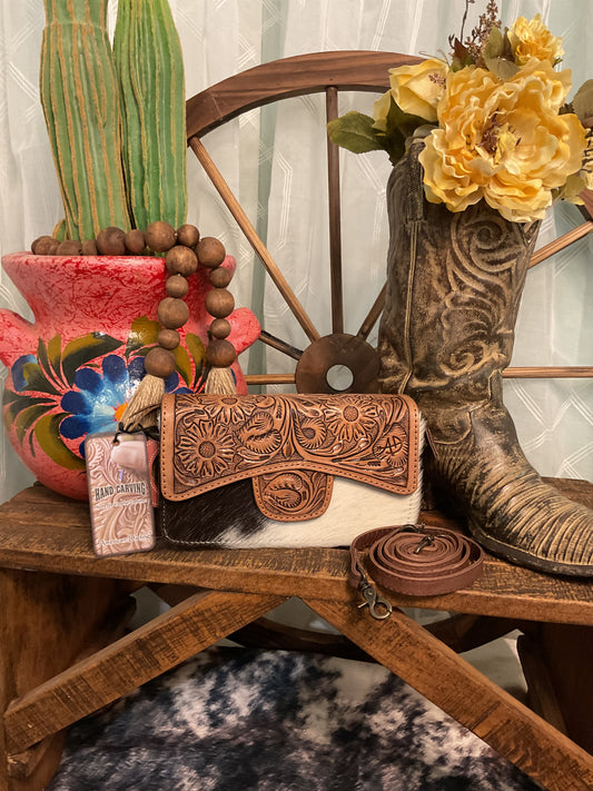 Uvalde Bag by American Darling – tooled leather and genuine hair-on cowhide bag with zippered and fold-over snap closure, detachable crossbody strap, versatile clutch or crossbody style.