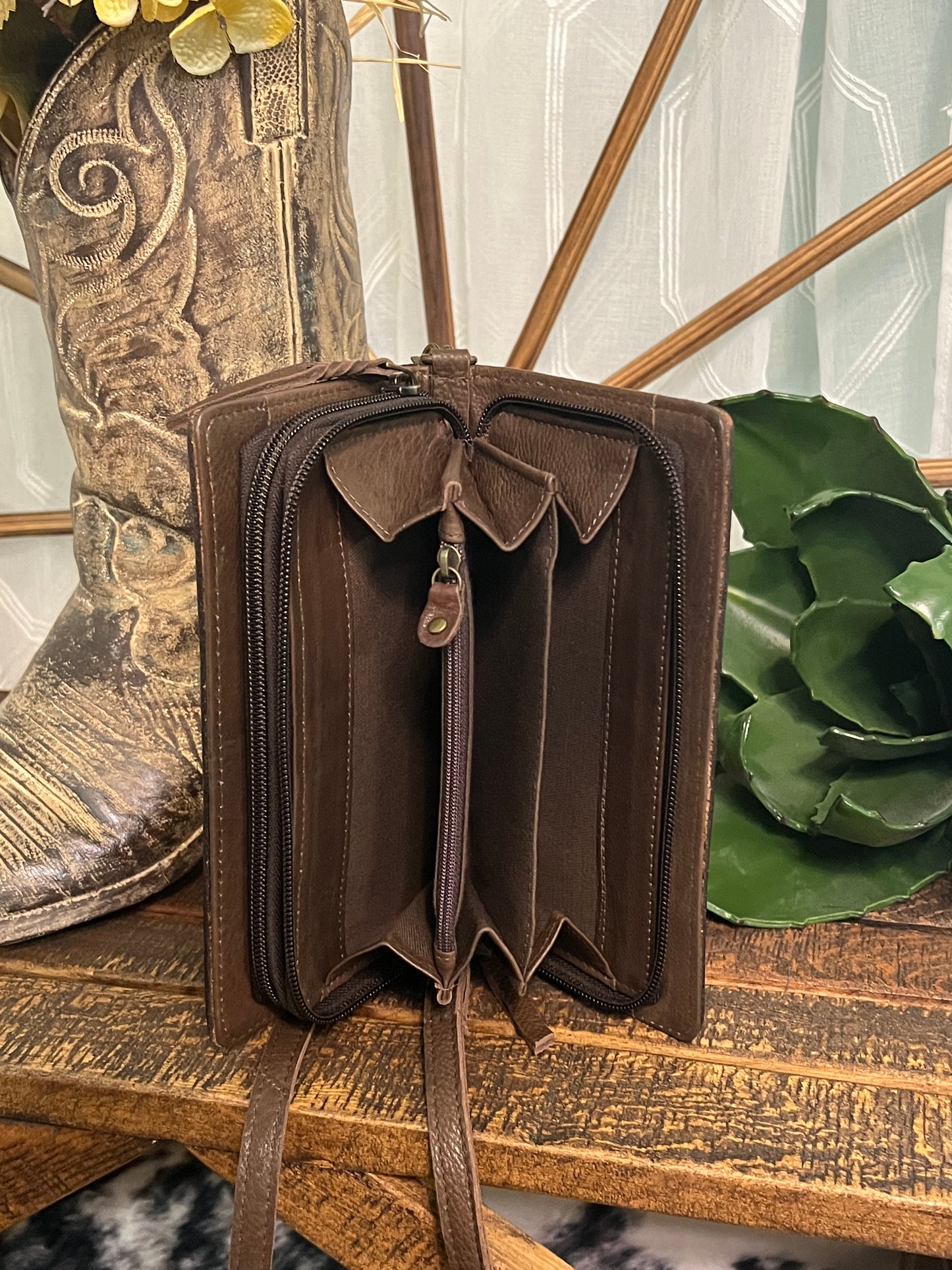 American Darling June Crossbody in hand-tooled leather, available in a classic design or tooled cactus design with green and pink accents, shown with adjustable crossbody and wristlet straps. Inside compartments offer excellent organization