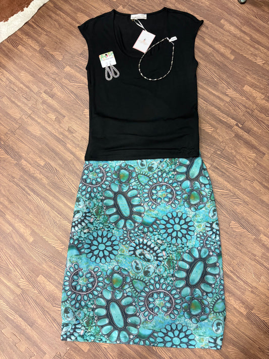 Dana Turquoise Mesh Skirt featuring a vibrant turquoise mesh overlay with a flowy, lightweight design. Perfect for adding a pop of color and effortless boho style to any outfit.