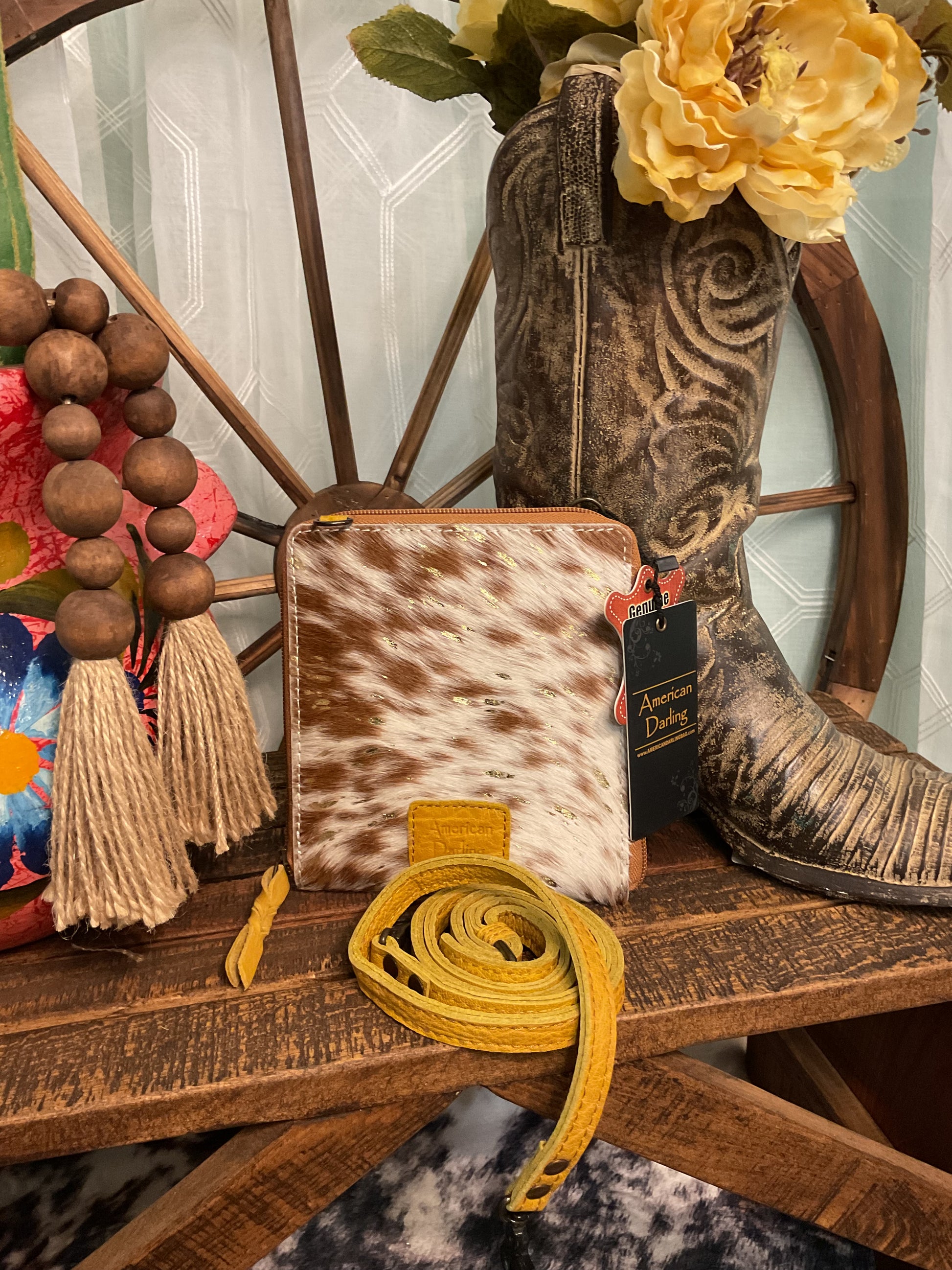 Knippa Bag – genuine hair-on cowhide crossbody with gold splatter design, two internal compartments, and card slots – stylish, functional western accessory.