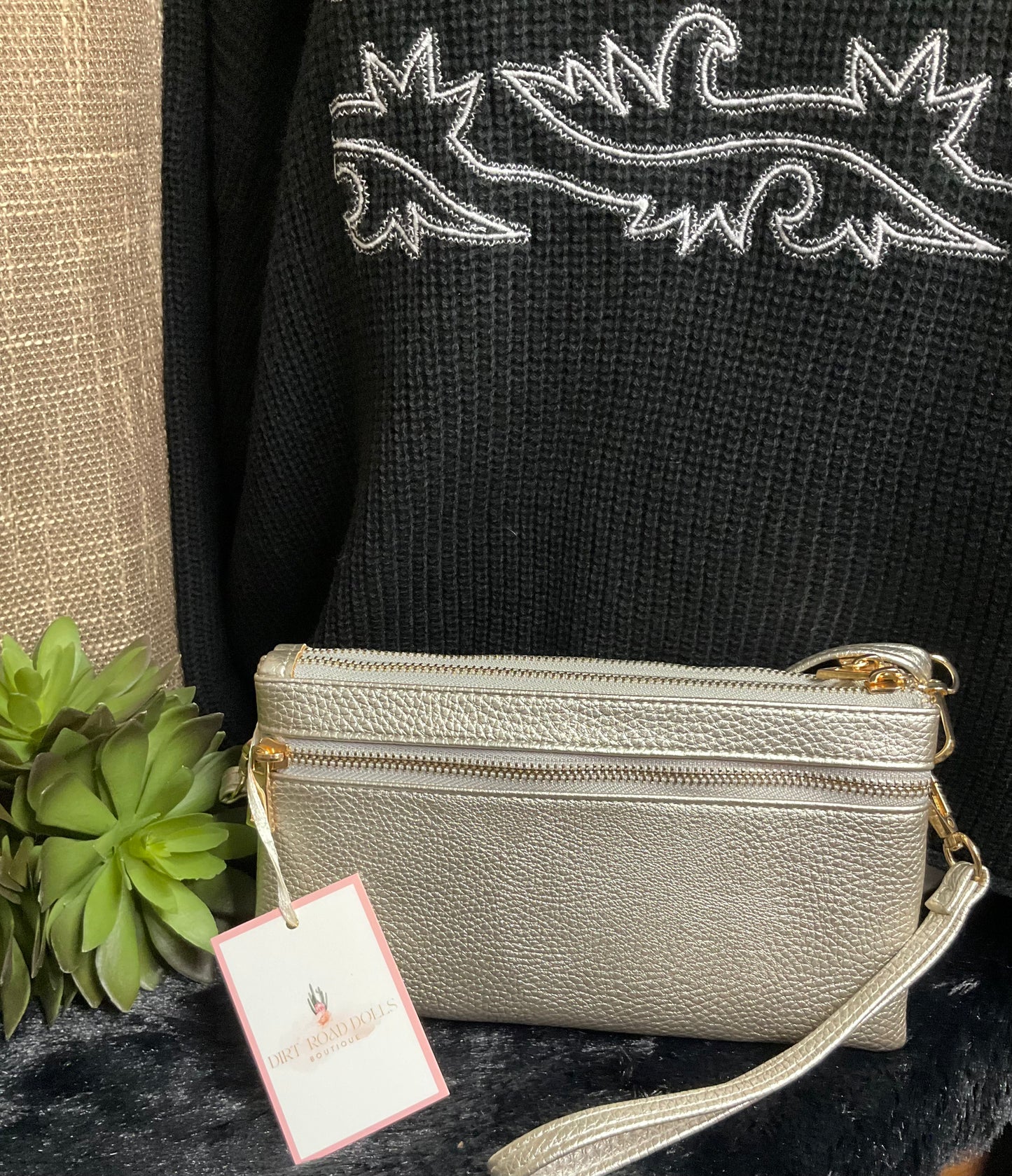 Uptown Convertible Bag in sleek silver textured faux leather with gold-tone fixtures – versatile clutch, wristlet, or crossbody with three compartments and two external zippered pockets.