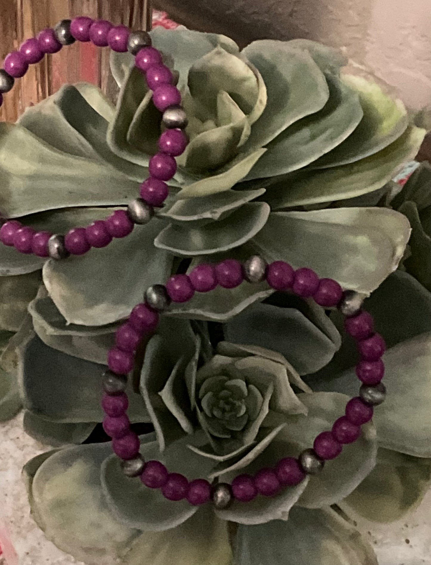 Bold purple beaded stretch bracelet with faux silver pearl accents