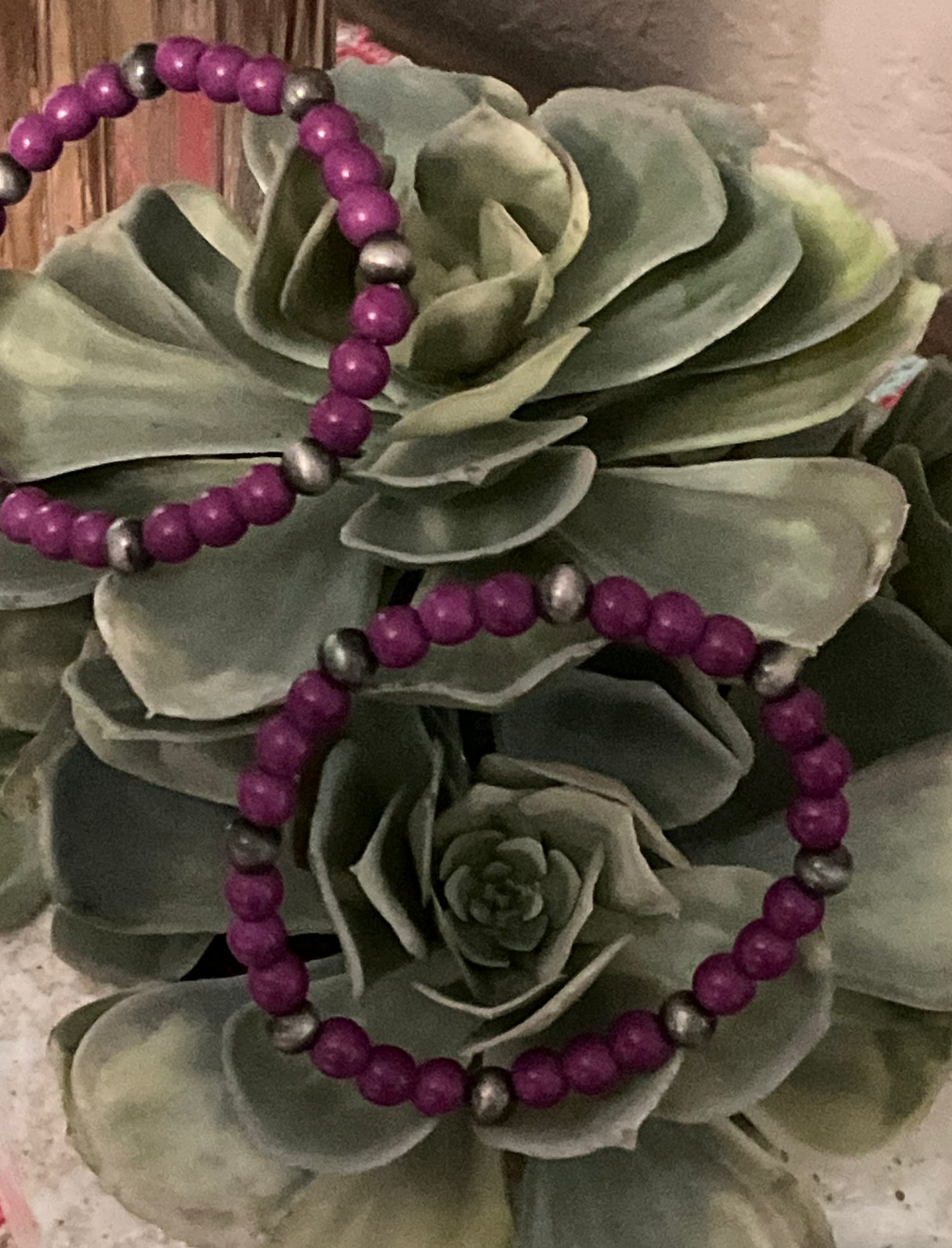 Bold purple beaded stretch bracelet with faux silver pearl accents