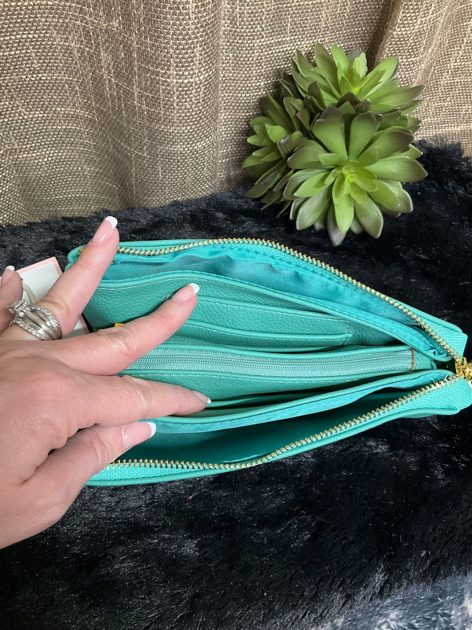 Selma Convertible Bag in textured faux leather with gold-tone fixtures – versatile clutch, wristlet, or crossbody with three zippered compartments and two card slots for organized day-to-night style.