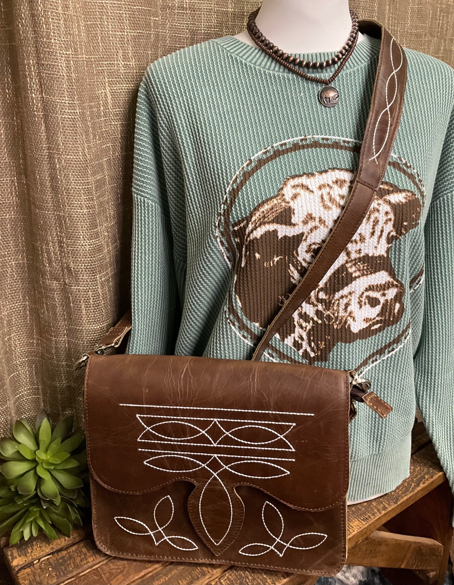 Texarkana Boot Stitch Crossbody in genuine leather with intricate boot stitch embroidery on front, back, and strap – classic western-style crossbody bag with snap flap closure.