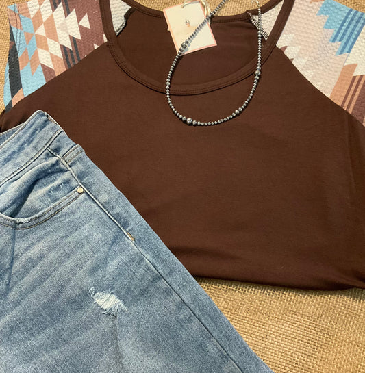 Carmen Aztec Sleeve Top featuring a soft, solid body with vibrant Aztec-patterned sleeves, adding a bold and colorful touch to your look.