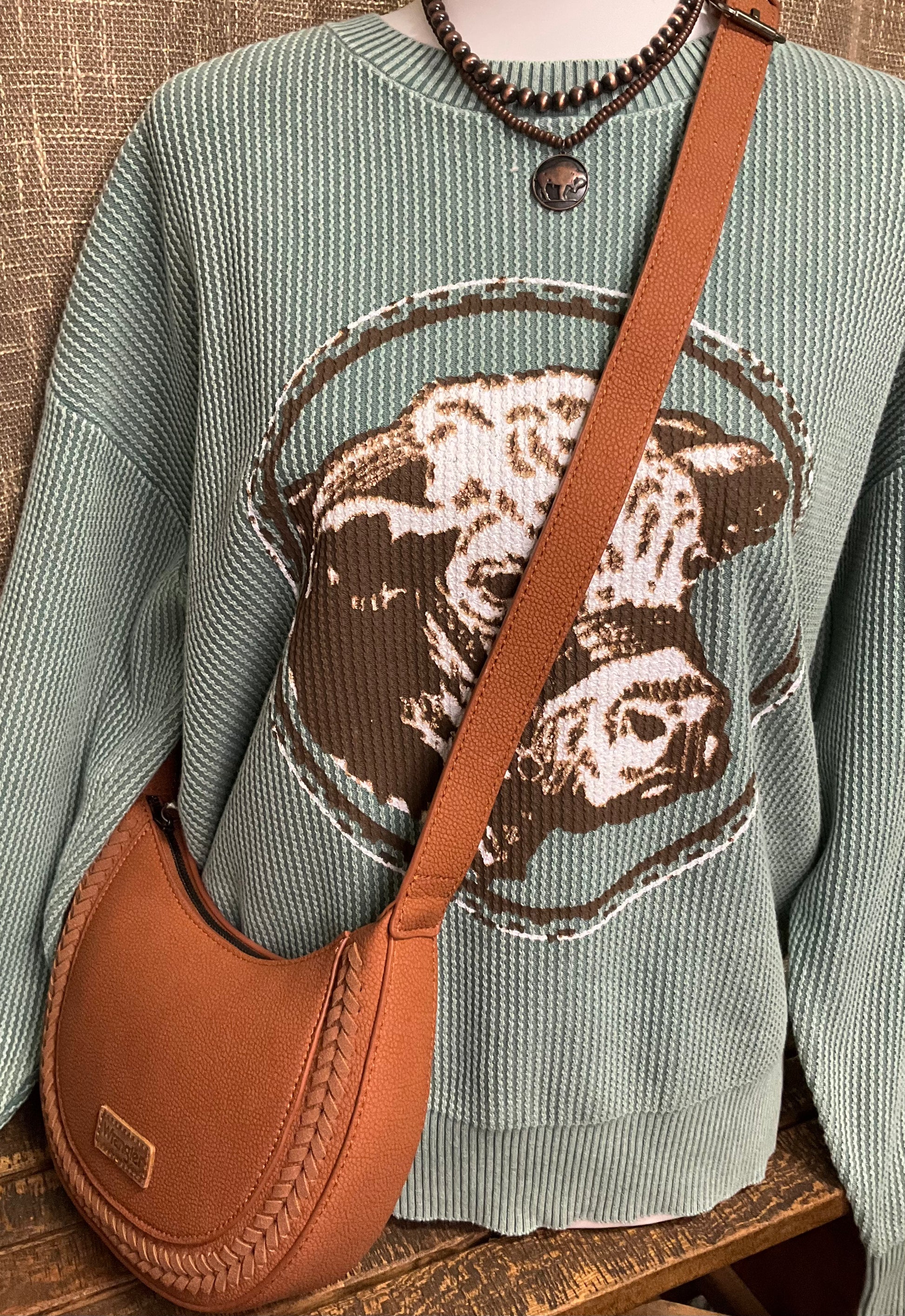 Okalla Shoulder Bag in genuine leather with buckle accent and western-inspired stitching – versatile shoulder or crossbody bag for rustic, elegant style.