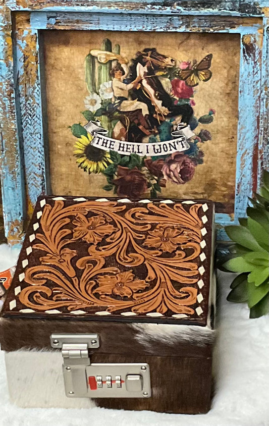 Hand-tooled leather and hair-on cowhide El Paso Jewelry Case by American Darling with 15 sections, snap closure straps, and a secure locking feature.