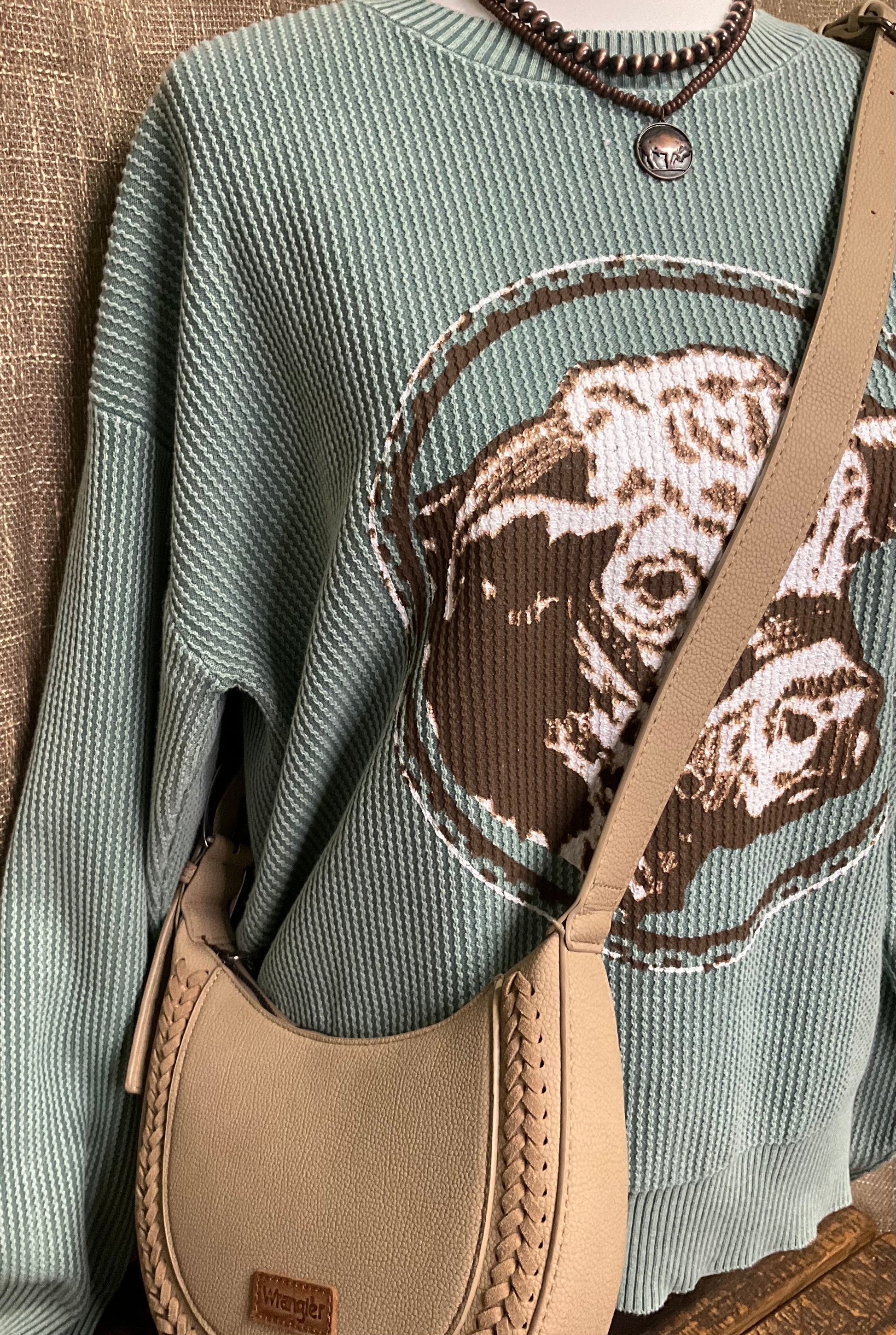 Okalla Shoulder Bag in genuine leather with buckle accent and western-inspired stitching – versatile shoulder or crossbody bag for rustic, elegant style.