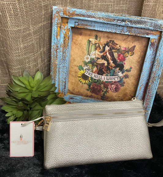 Uptown Convertible Bag in sleek silver textured faux leather with gold-tone fixtures – versatile clutch, wristlet, or crossbody with three compartments and two external zippered pockets.