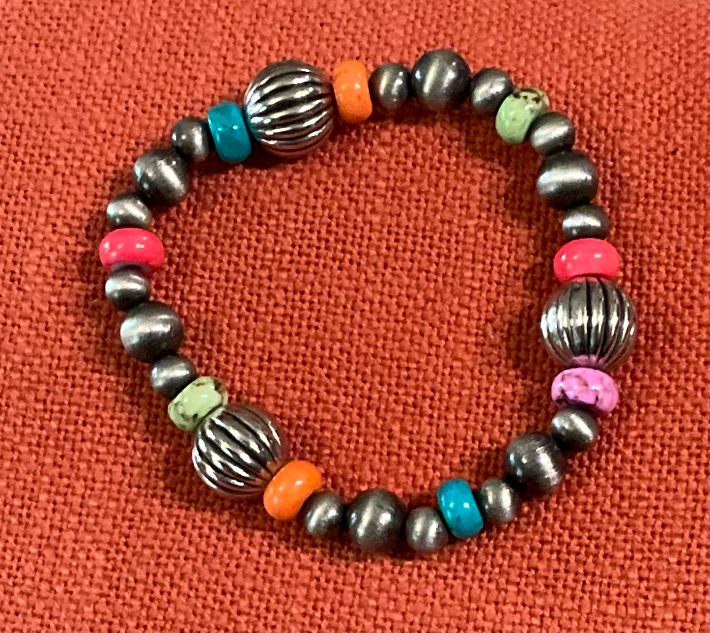 Sonora Sunrise Bracelet featuring vibrant, multi-colored beads in warm earthy tones, perfect for adding a pop of color to your stackable bracelet collection.