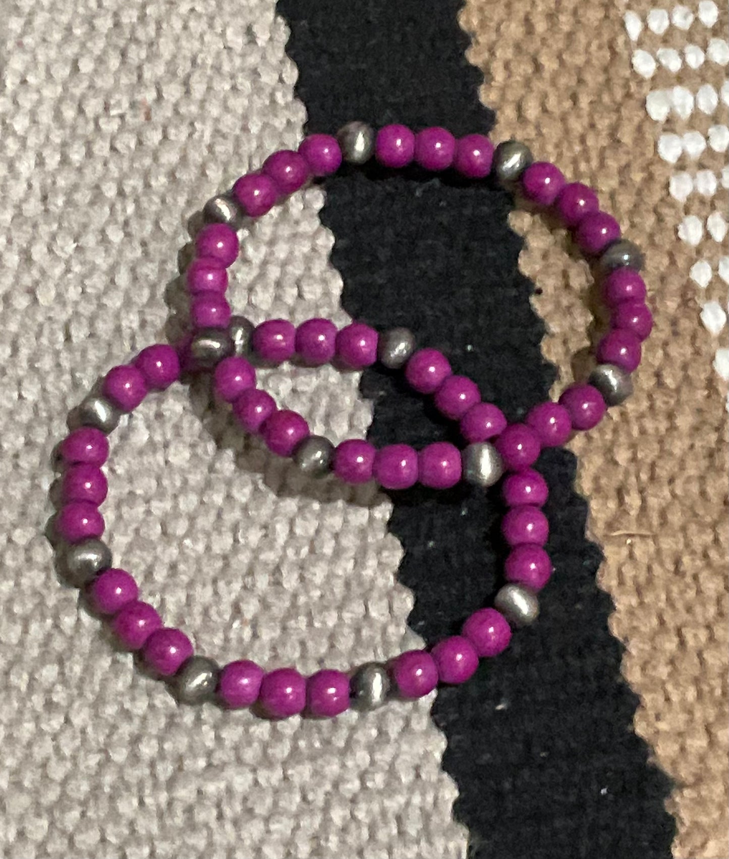 Bold purple beaded stretch bracelet with faux silver pearl accents