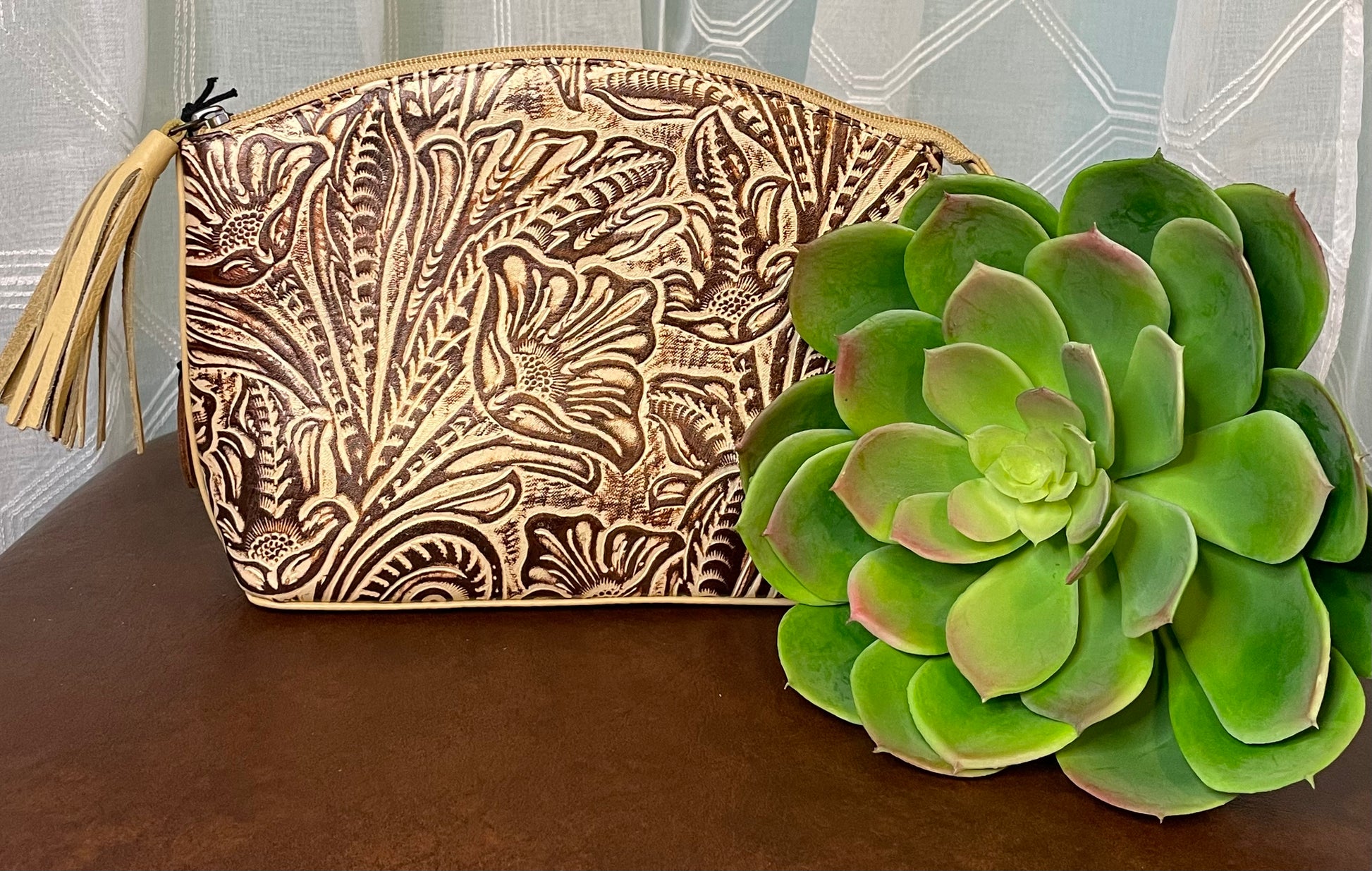 Fort Worth Clutch – versatile tooled leather clutch with tassel, transforms into a pouch – stylish western accessory.