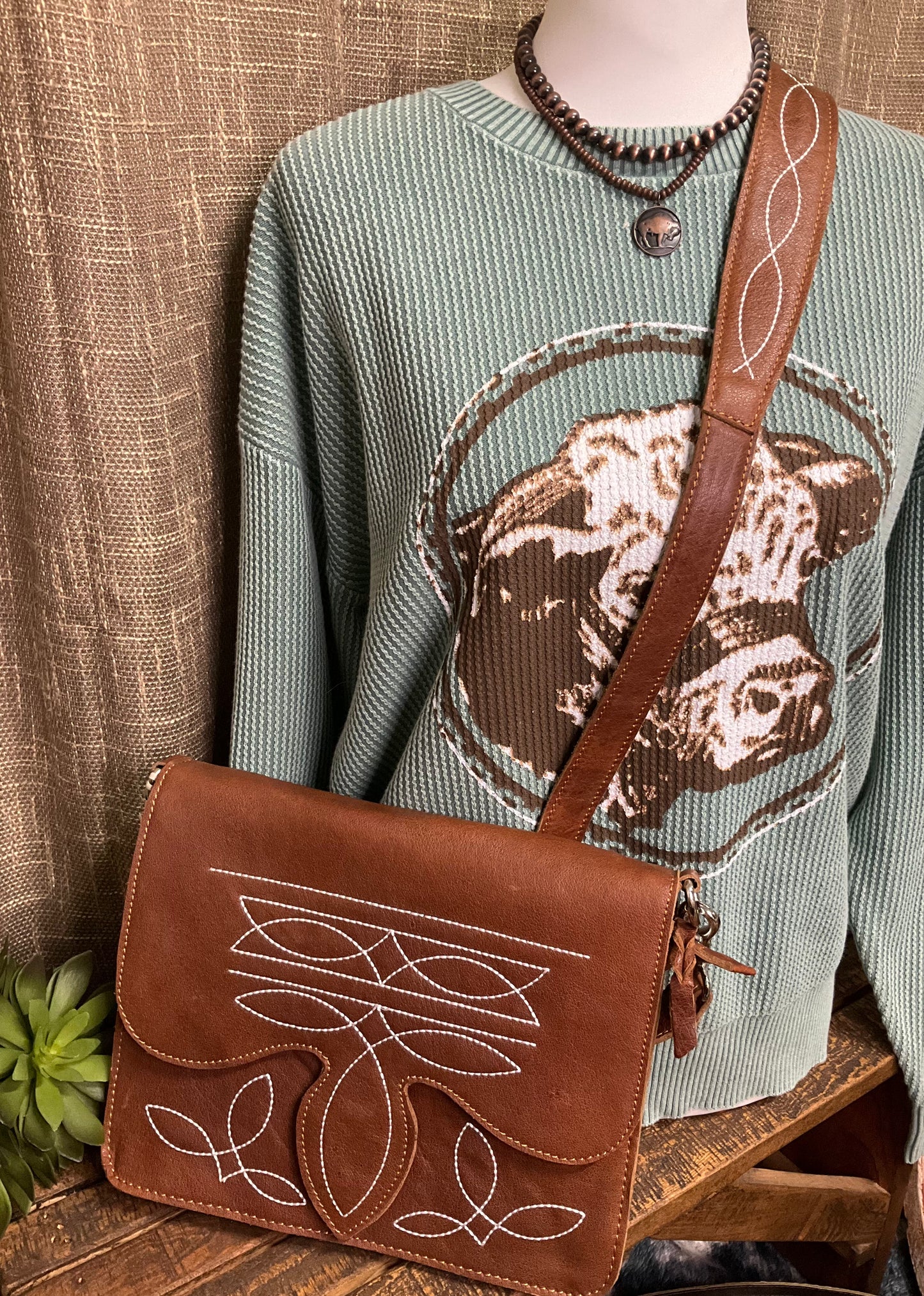 Texarkana Boot Stitch Crossbody in genuine leather with intricate boot stitch embroidery on front, back, and strap – classic western-style crossbody bag with snap flap closure.