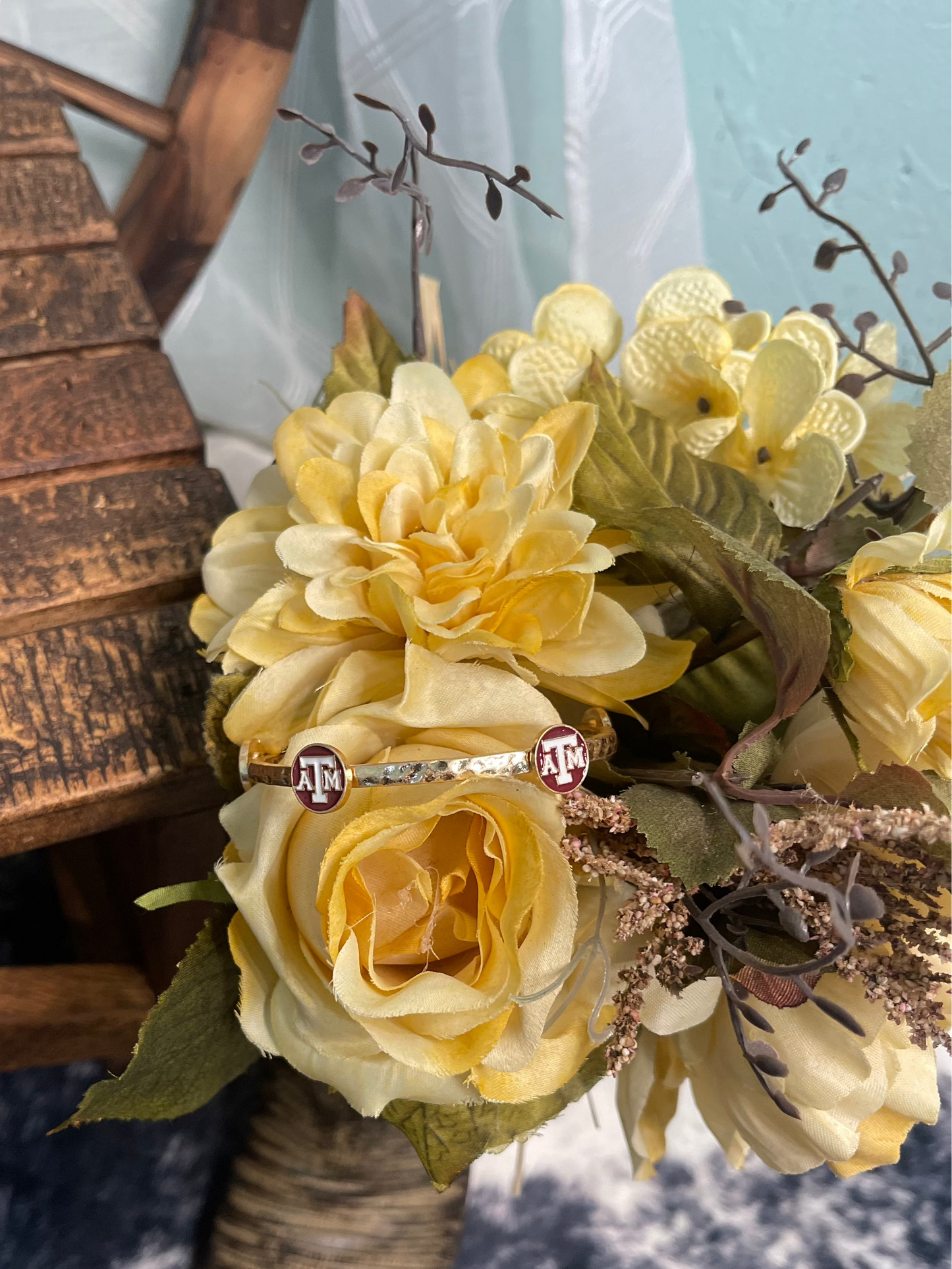 gold plated hammered bangle bracelet with enamel maroon and white Texas A&M University logo