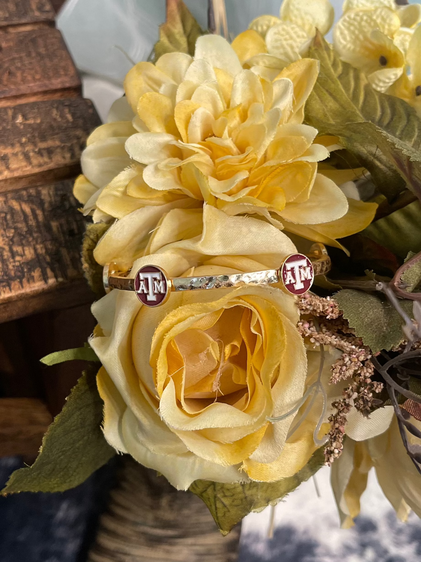 gold plated hammered bangle bracelet with enamel maroon and white Texas A&M University logo
