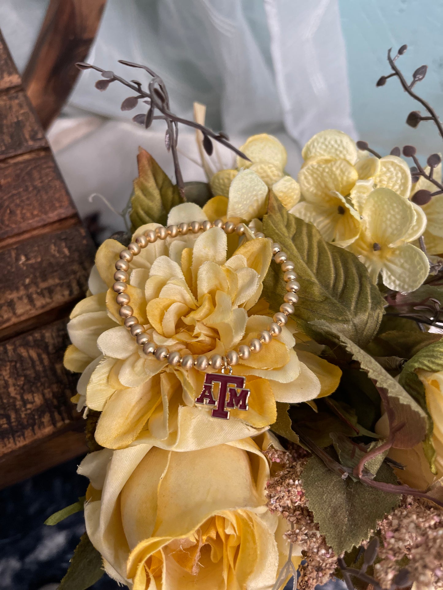 gold plated beaded stretch bracelet with enamel Texas A&M University logo