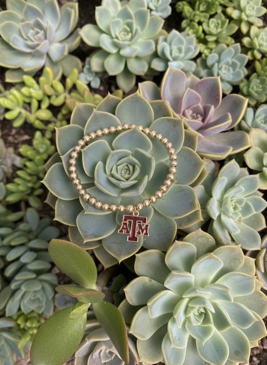 gold plated beaded stretch bracelet with enamel Texas A&M University logo