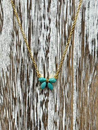 Turquoise bow necklace with bright blue Kingman stones, delicate gold over sterling silver chain