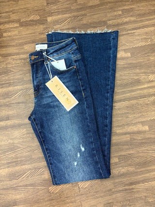 Risen Sawyer mid-rise flare jeans with light distressing and cut hem, women’s boutique denim