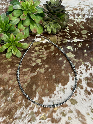 Sterling silver pearl necklace featuring graduated 4mm, 5mm, 6mm, and 8mm beads with extender chain