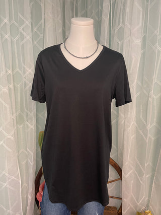 Comfortable black boutique top with curved hem and easy everyday styling