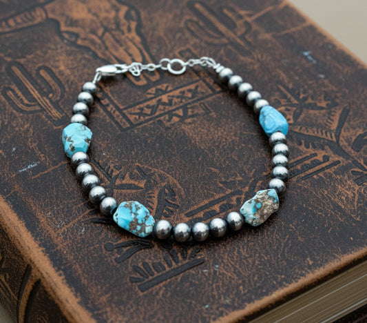 Sterling silver pearl bracelet with Golden Hill turquoise beads and extender chain.