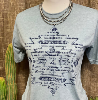Southwest graphic tee featuring distressed western-inspired artwork on stonewash blue Bella Canvas shirt