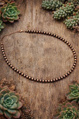 18 inch copper pearl necklace with 7mm round copper beads shown on neutral background western boutique jewelry Dirt Road Dolls