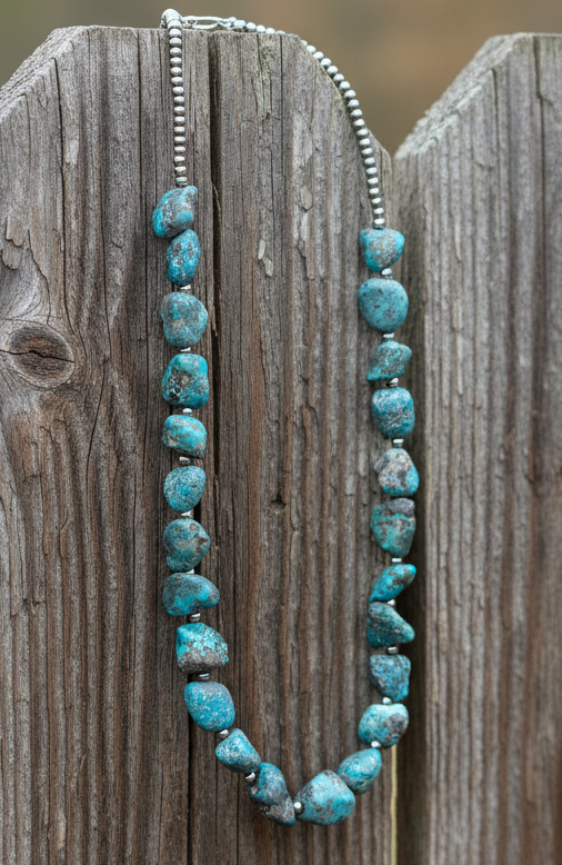 One-of-a-kind turquoise nugget necklace with natural blue stones and 4mm sterling silver pearls, shown to highlight unique shapes, color variation, and polished sterling findings.