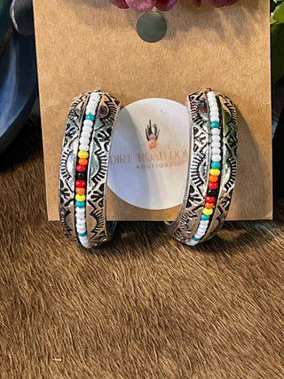 1.5" hoop earrings decorated with serape-inspired multicolor seed beads, lightweight Southwestern design.