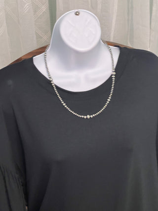 Sterling silver graduated pearl necklace with mixed bead sizes and adjustable extender chain
