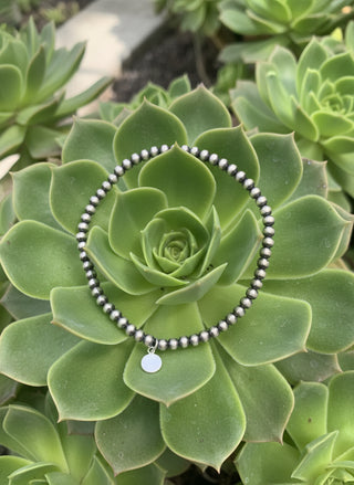 Perla Sterling Stretch Bracelet made with 3mm polished sterling pearls on a stretch band