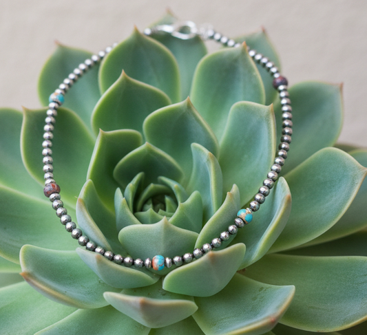 Sterling silver beaded necklace with  Mojave turquoise accents and adjustable extender chain.