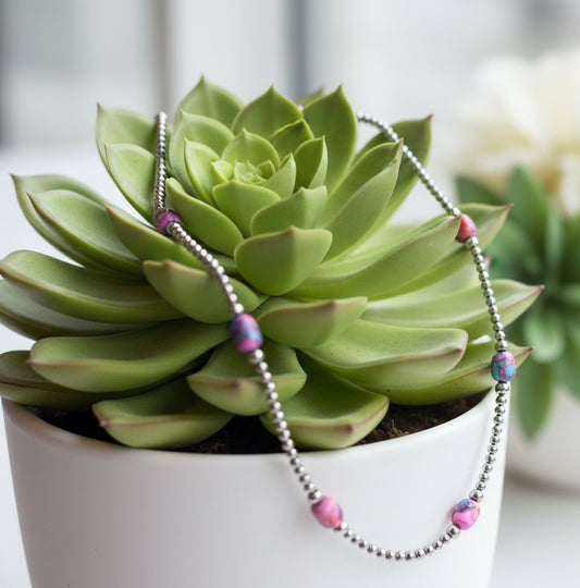 Sterling silver pearl necklace with pink and purple Mojave turquoise stones and extender chain.
