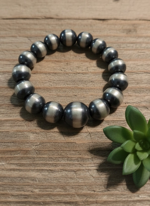 Oxidized sterling silver pearl ring featuring polished round silver beads