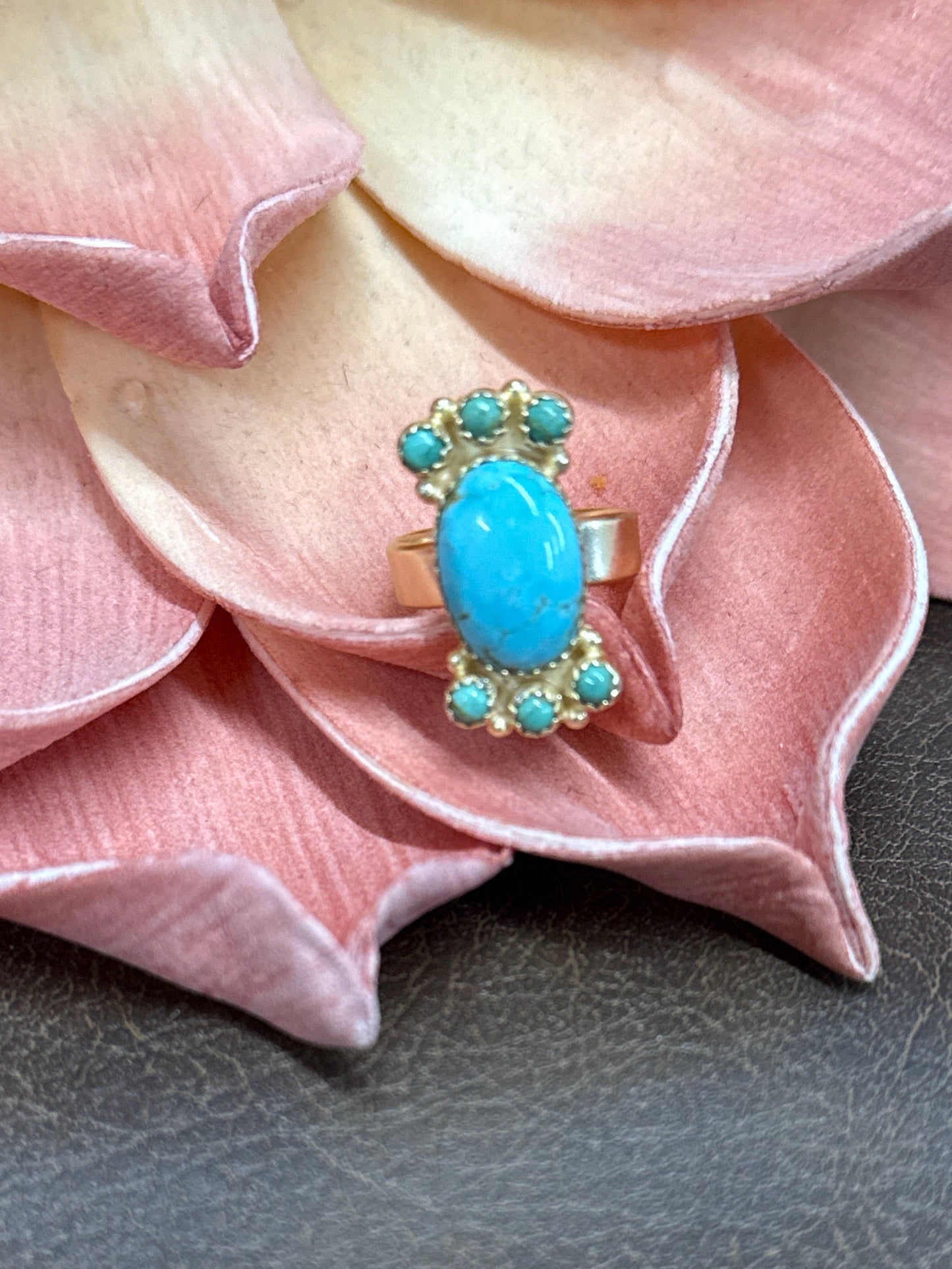 Turquoise statement ring with oval center stone and stacked accents, gold over sterling silver adjustable ring