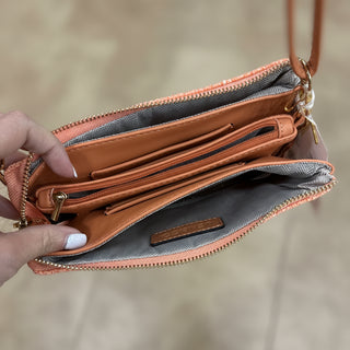 Neutral woven crossbody purse with faux leather strap and compact organizer design