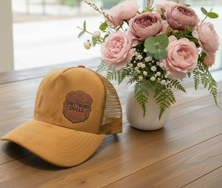 light brown suede trucker hat with leather Dirt Road Dolls patch and mesh back western cap