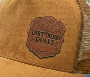 brown mesh back trucker hat with Dirt Road Dolls leather logo patch casual ranch style